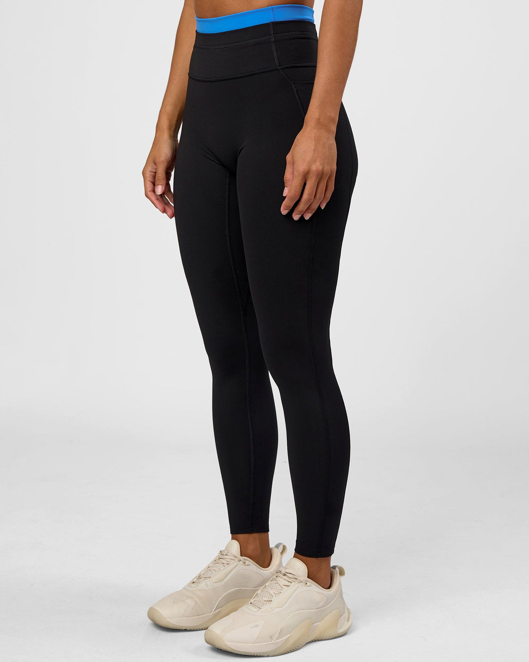 Woman wearing Liberate High-Rise Full Length Legging Pockets - Black-Palace Blue | Model:Brylee | Size:XS