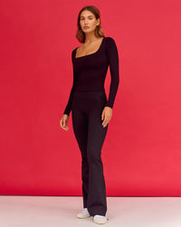 Woman wearing Show It Off Long Sleeve Top in Black 