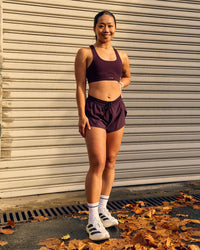 Woman wearing Fast-Track Sports Bra - Cherry Lacquer | Thumbnail Index: 2