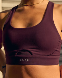 Woman wearing Fast-Track Sports Bra - Cherry Lacquer | Thumbnail Index: 0