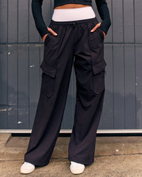 Woman wearing Endeavour Cargo Pant - Black | Thumbnail Index: 0