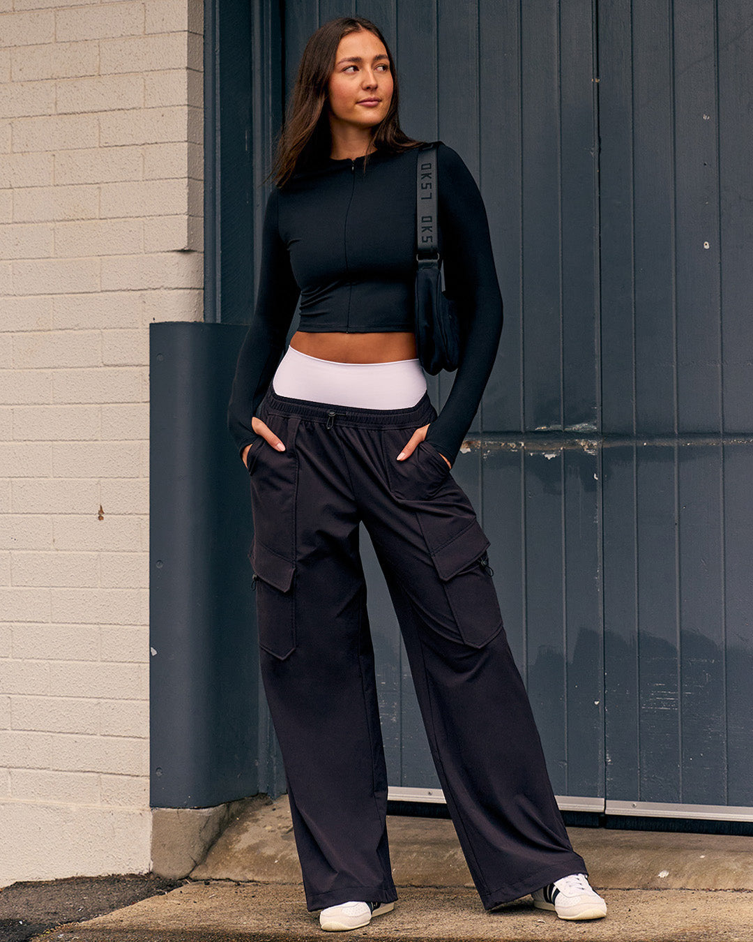 Woman wearing Endeavour Cargo Pant - Black - view 3