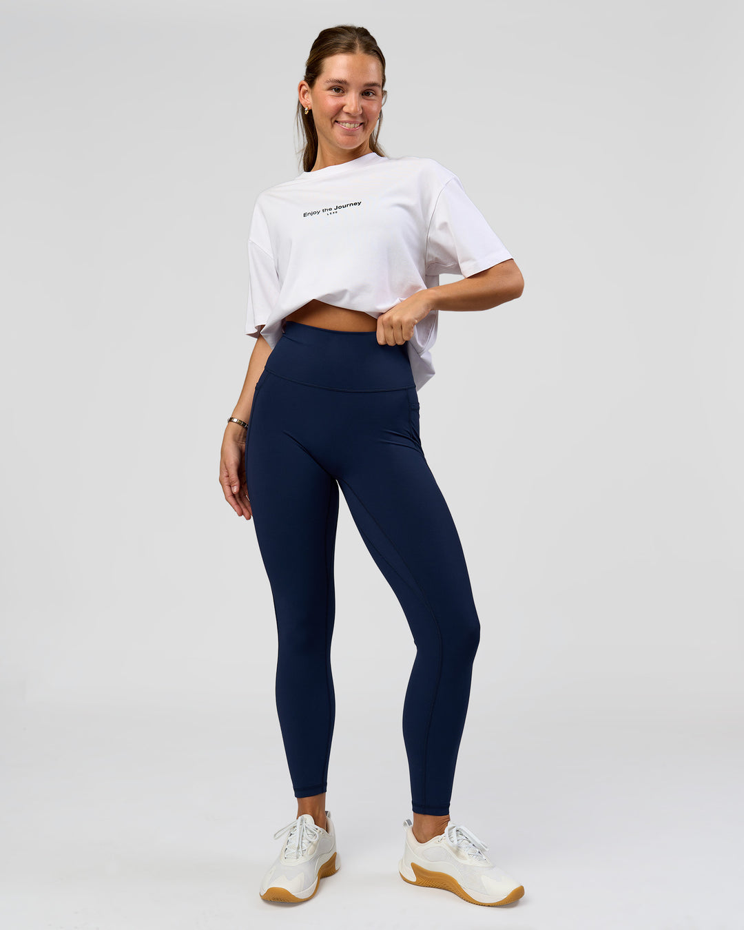 Woman wearing O.G. Fusion Ultra High-Rise Full Length Legging Pockets - Future Navy | Model:Amity| Size:S - view 1