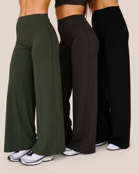 Woman wearing Elixir High-Rise Petite Pant - Pure Olive | Model:Issy | Size:XS | Thumbnail Index: 1