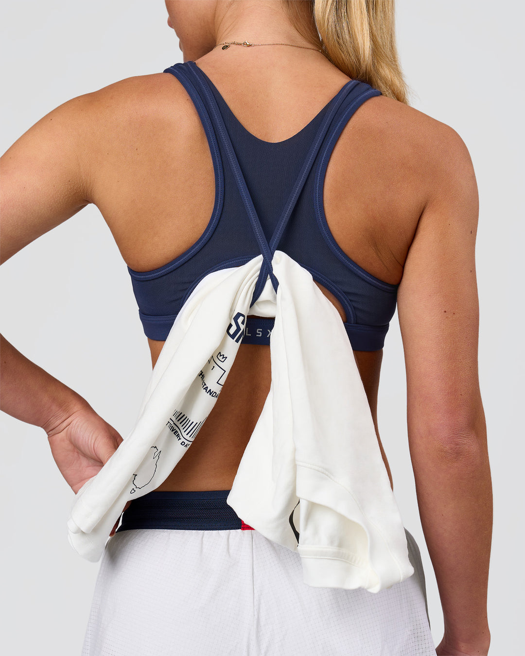 Woman wearing Unstoppable Racerback Sports Bra - Future Navy| Model:Issy| Size:XS - view 2