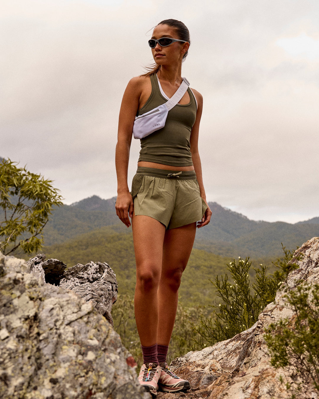 Woman wearing Accelerate 3" Mid-Rise Running Short - Pure Olive-Fog - view 2