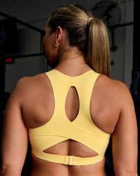 Woman wearing Fusion Sports Bra 2.0 - Lemon | Thumbnail Index: 1