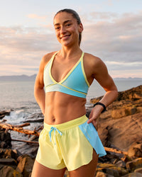 Woman wearing Breeze Sports Bra - Baltic Sea-Lemon | Model:Grace | Size:XS | Thumbnail Index: 1