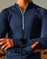 Woman wearing GG AeroFLX+ Long Sleeve Half Zip - Future Navy-Baltic Sea | Model:Grace | Size:XS
