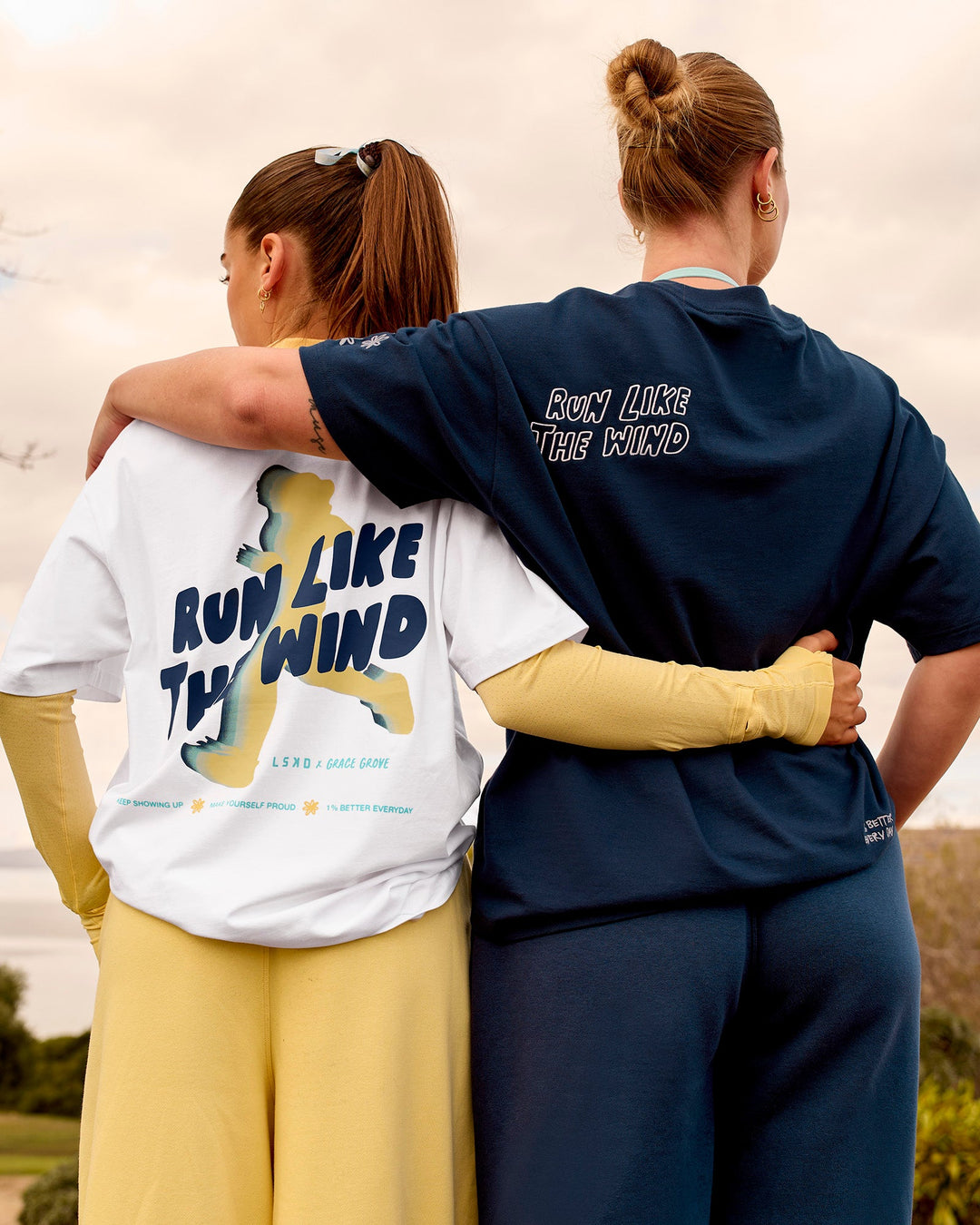 Woman wearing Woman wearing Run Like The Wind FLXCotton Oversized Tee - White-Future Navy | Model:Grace | Size:S