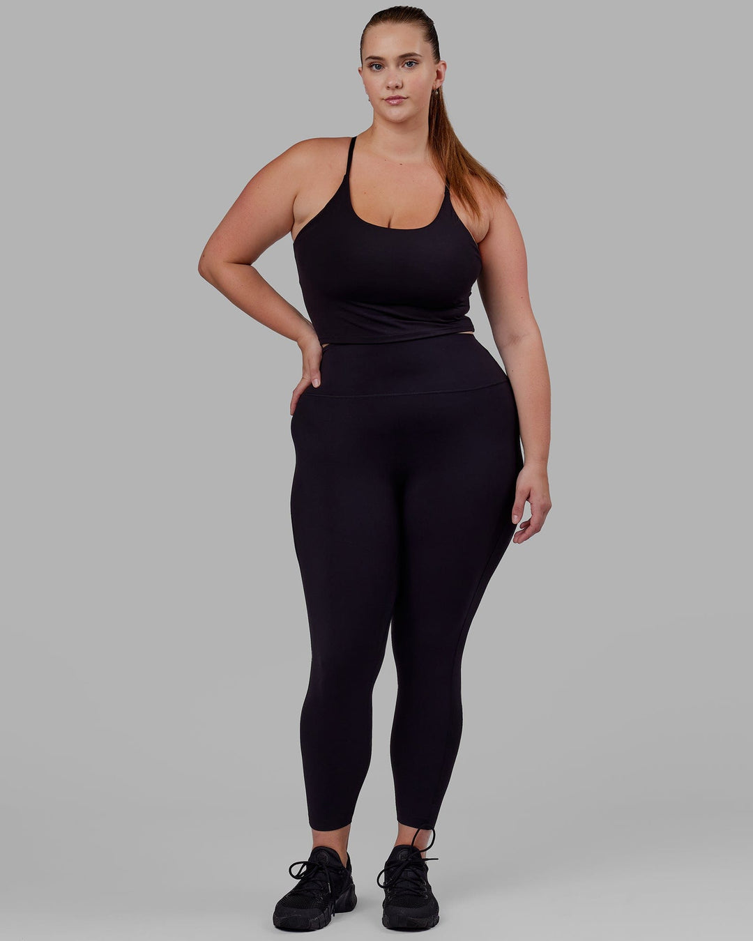 Woman wearing Elixir Full Length Tight - Black No Logo