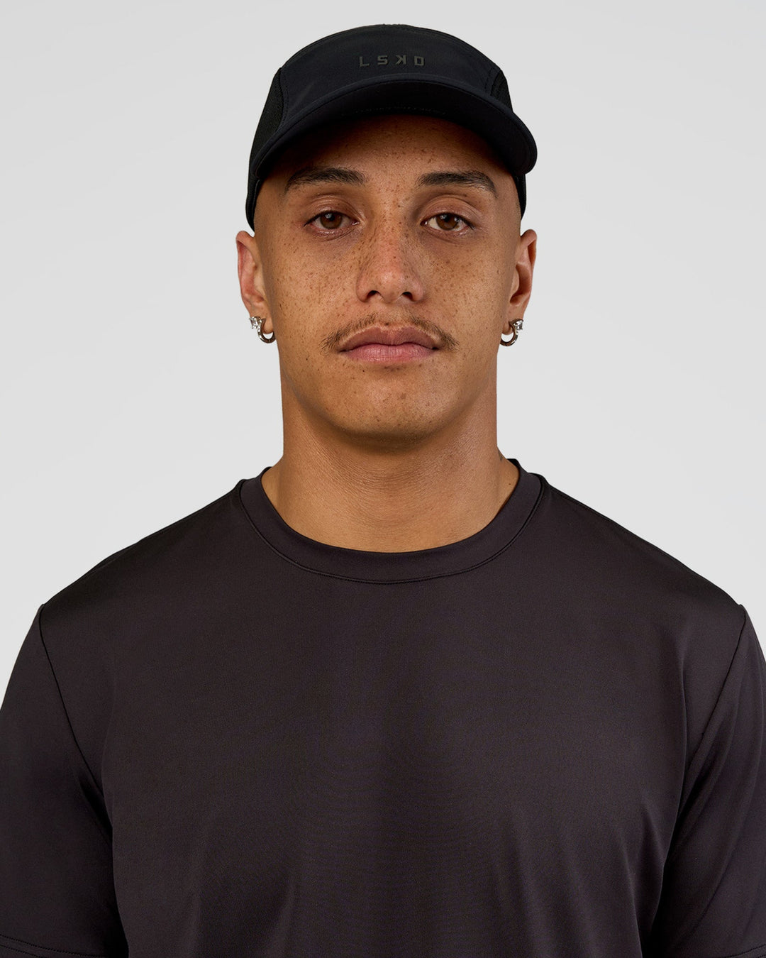 Man wearing Accelerate Cap - Black