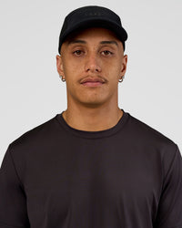 Man wearing Accelerate Cap - Black