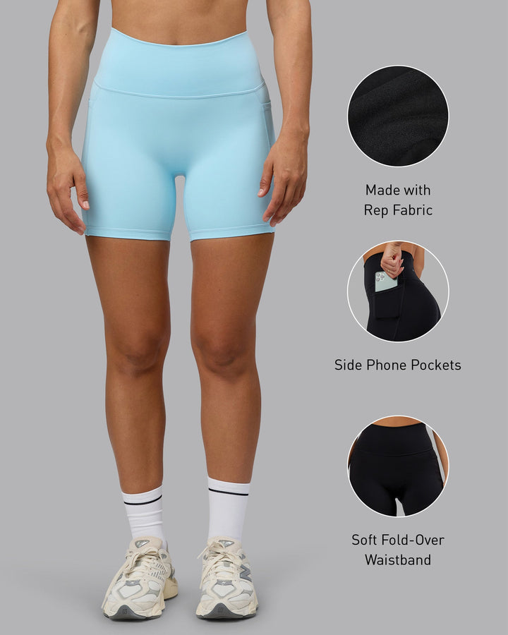 Woman wearing Fusion Mid Short Tights with Pockets - Crystal Blue
