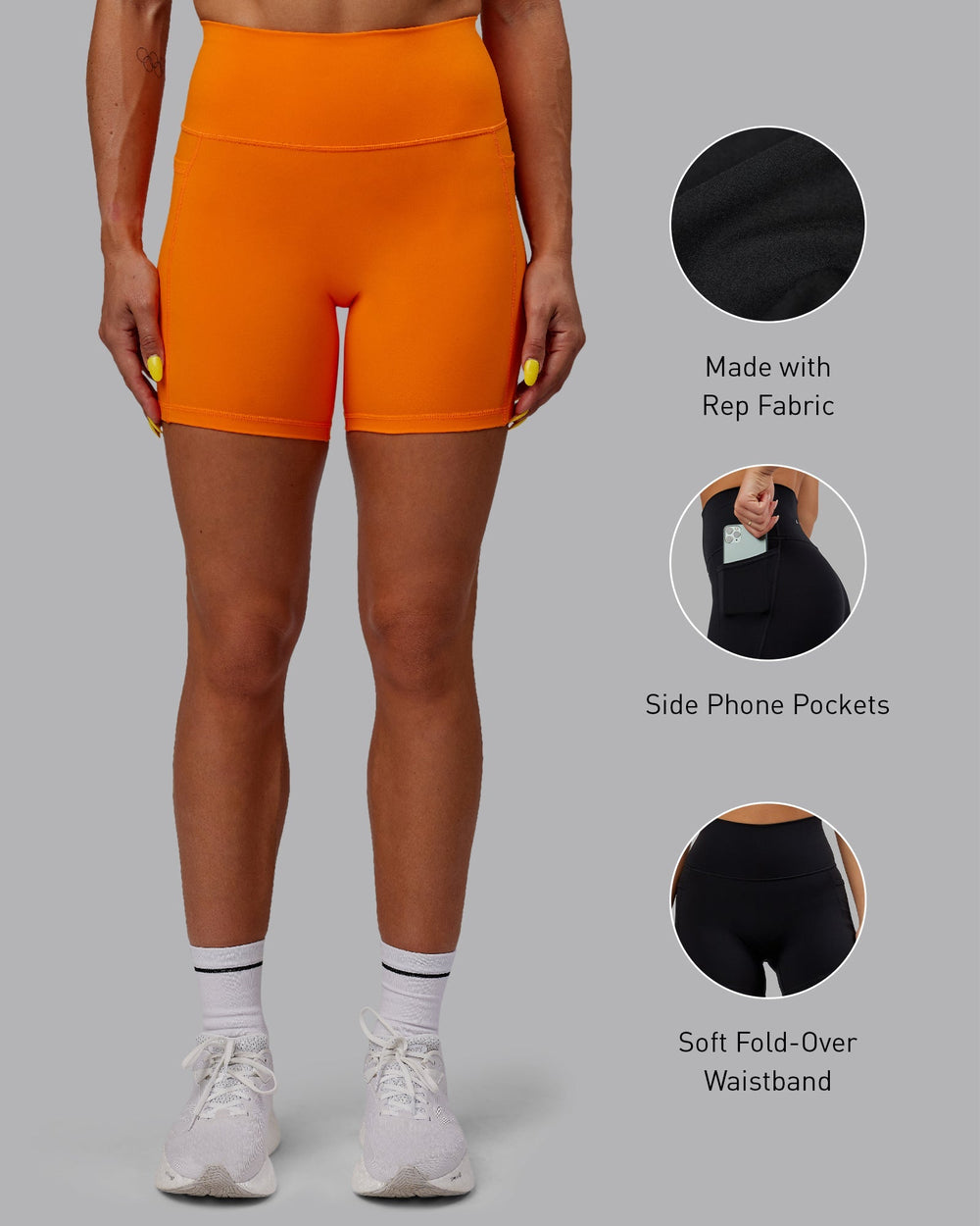 Woman wearing Fusion Mid-Length Shorts - Vibrant Orange