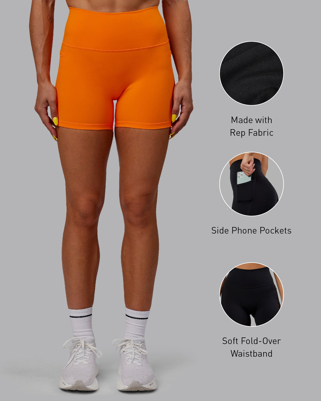 Woman wearing Fusion X-Length Shorts - Vibrant Orange