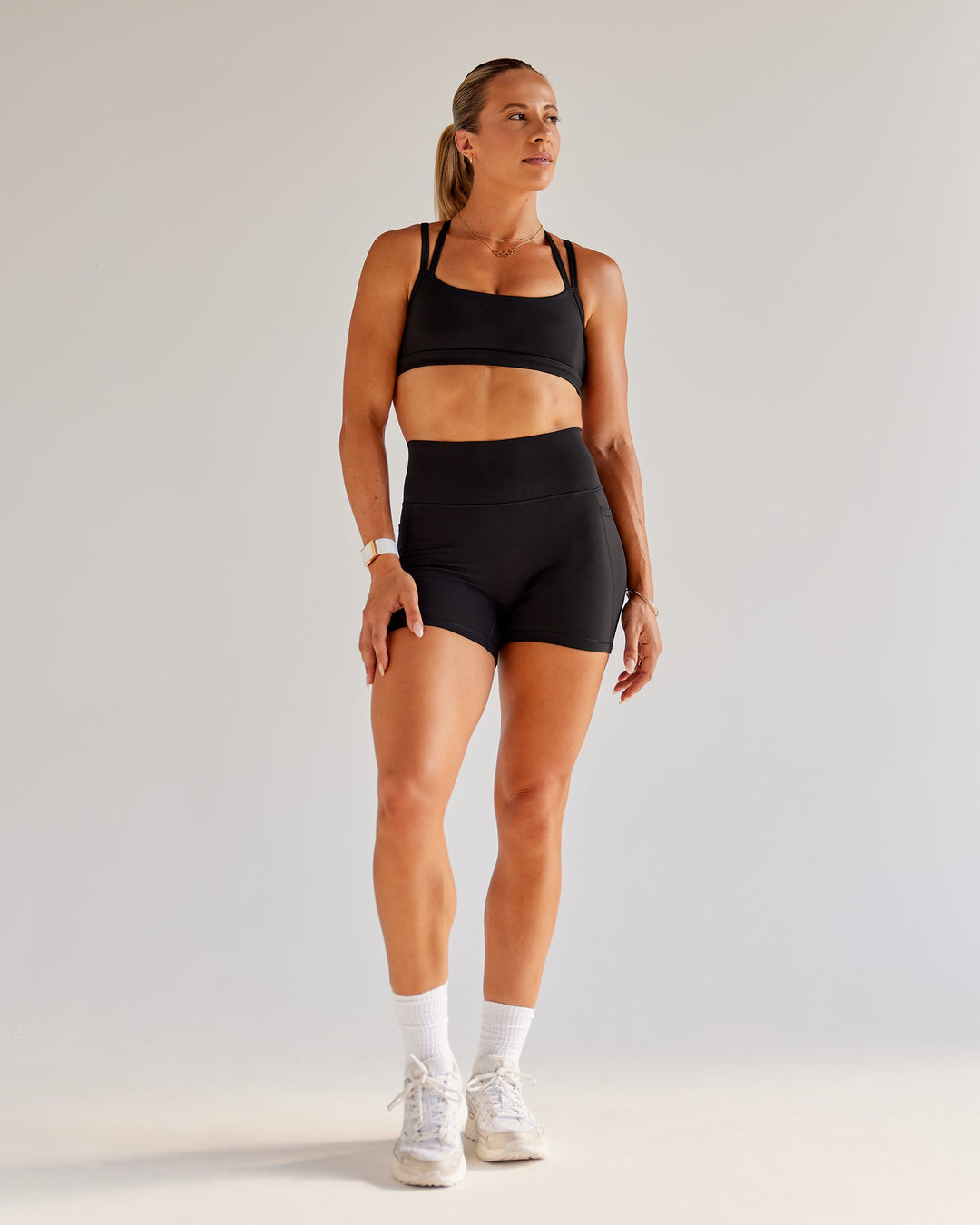 Woman wearing Bree Masters Velocity Sports Bra - Black