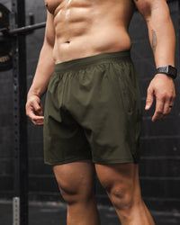 Man wearing Challenger 6" Performance Short - Forest Night