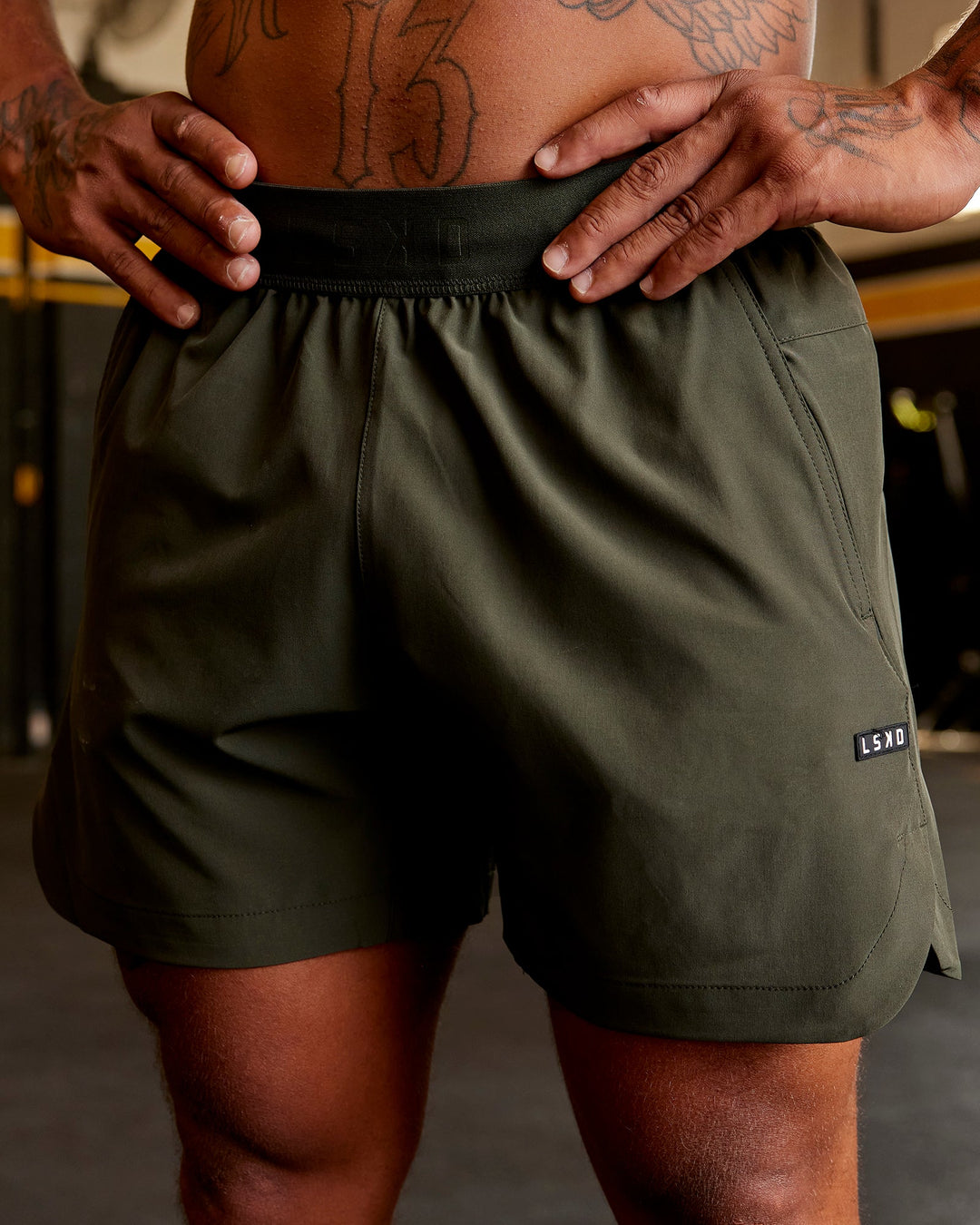 Man wearing Competition 5" Performance Short - Forest Night