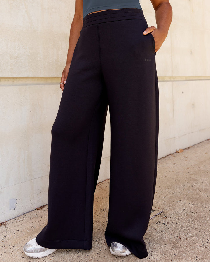 Woman wearing Elevate SoftTouch Wide Leg Pants - Black-Black
