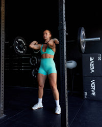 Woman wearing Fusion Ultra High-Rise 4" Short Pockets - Aquatic Awe | Model:Robyn | Size:S