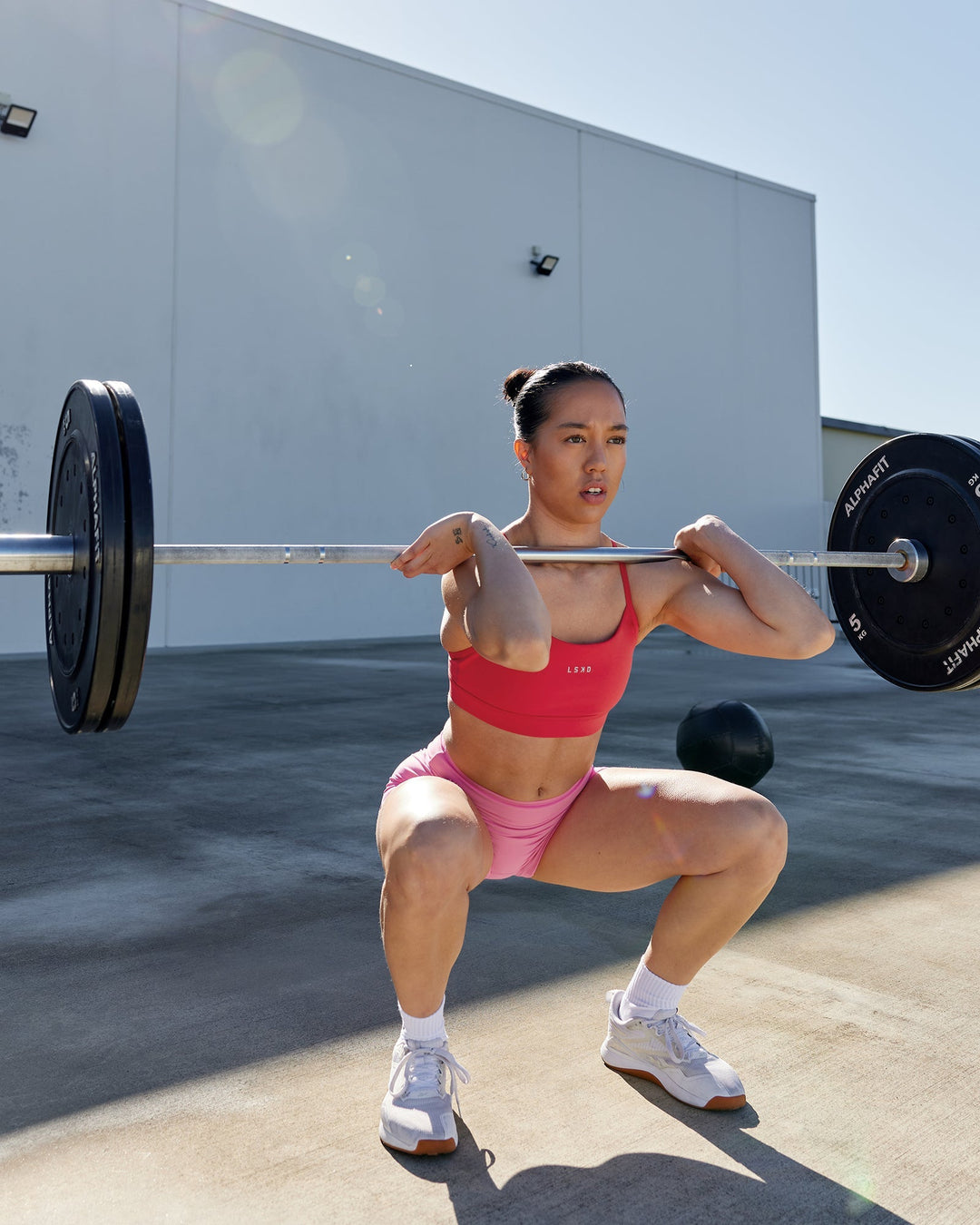 Woman wearing Lift Sports Bra - Scarlet