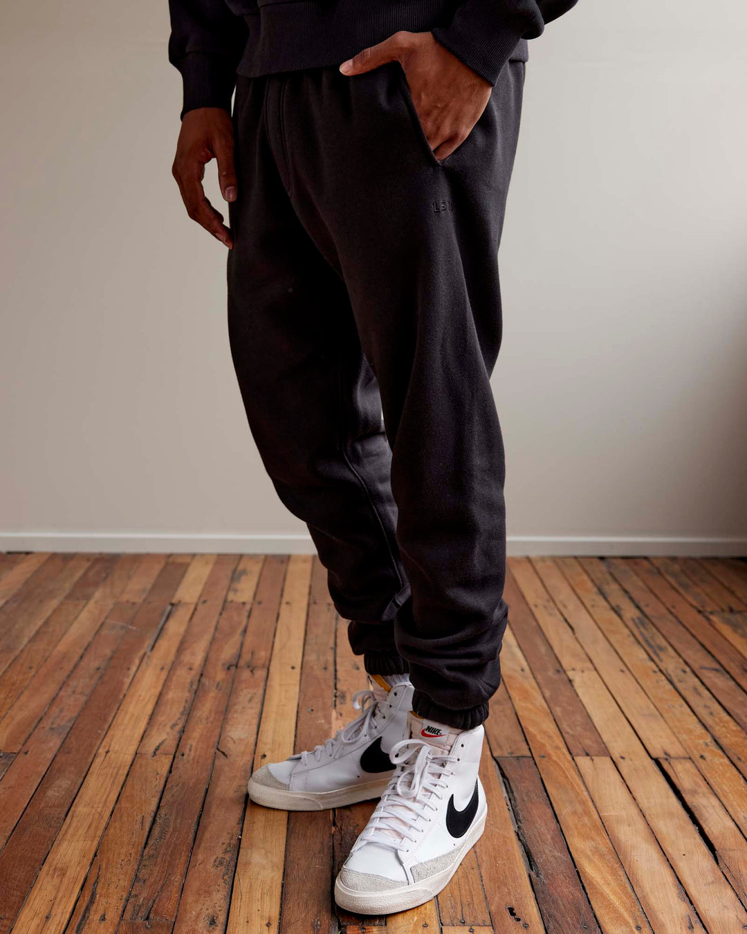 Man wearing MVP Track Pants - Black