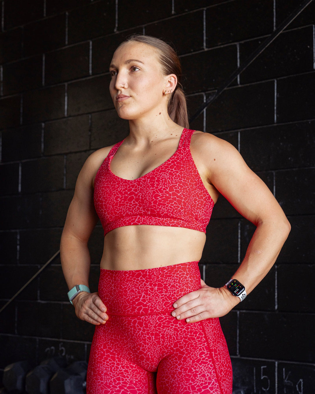 Woman wearing Push The Limit Sports Bra - Red Vitality Print