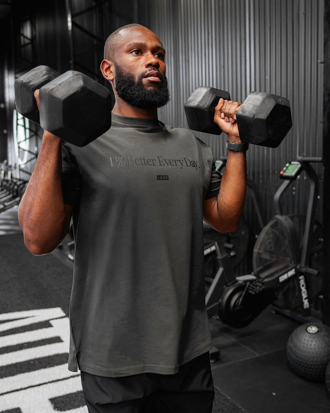 Man wearing Unisex 1% Better FLXCotton Tee Oversize - Pirate Black-Black