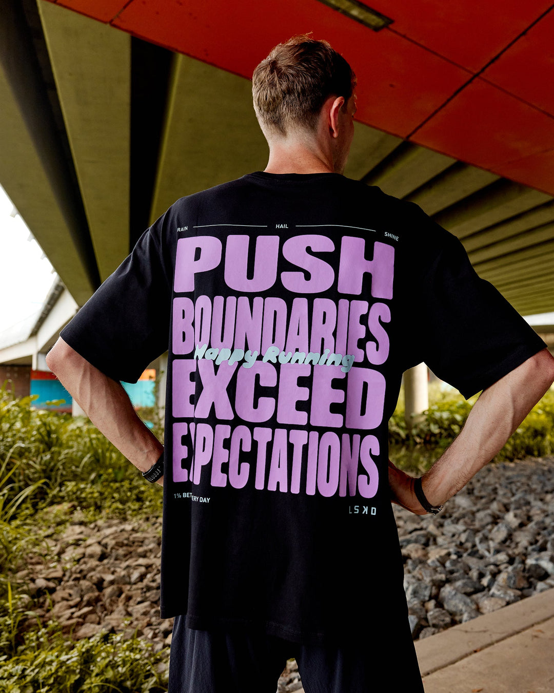 Man wearing Unisex Push Boundaries FLXCotton Tee Oversize - Black-Purple Swirl