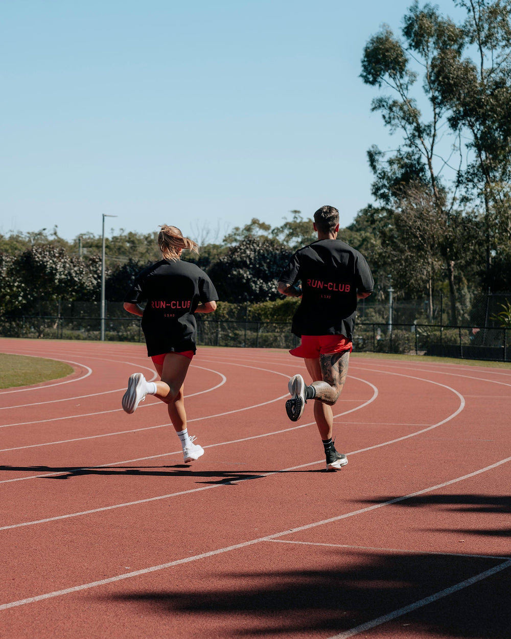 Duo wearing Unisex RUN CLUB FLXCotton Tee Oversize - Black-Cayenne