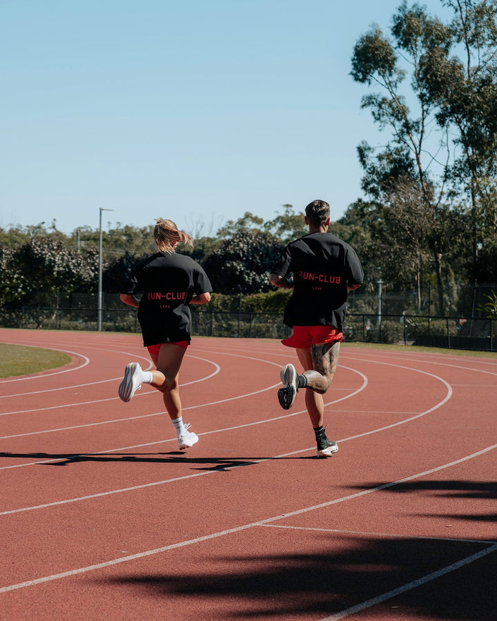 Duo wearing Unisex RUN CLUB FLXCotton Tee Oversize - Black-Cayenne
