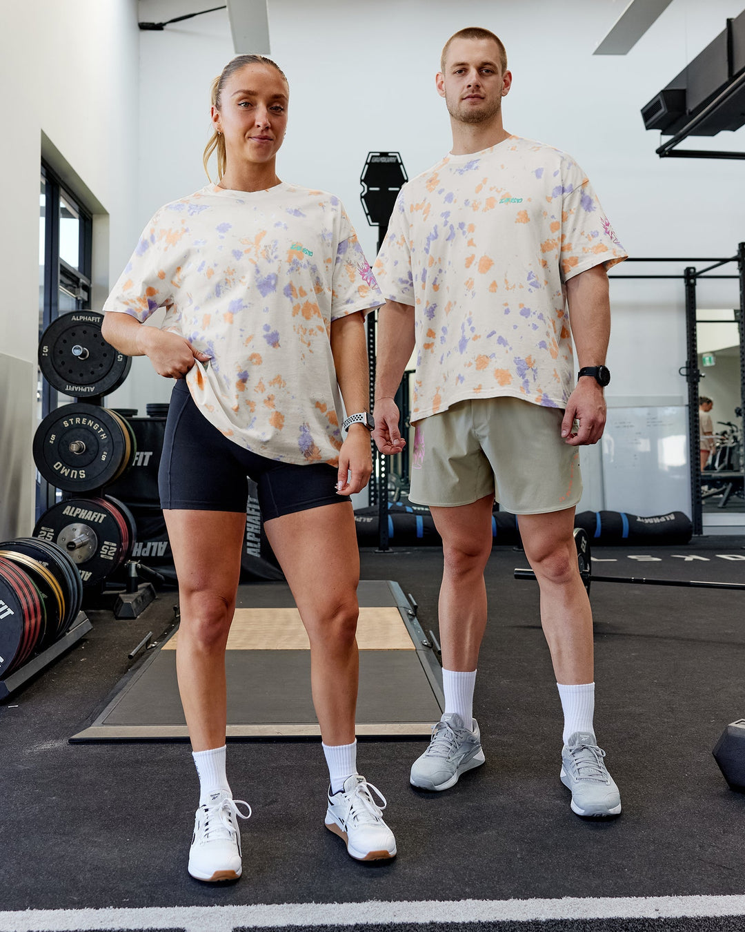 Duo wearing Unisex Washed Huntington 24 Heavyweight Tee Oversize - Tie Dye Tangerine-Dahlia Purple