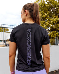 Woman wearing Pace Keep on Running Tee - Black-Dahlia Purple