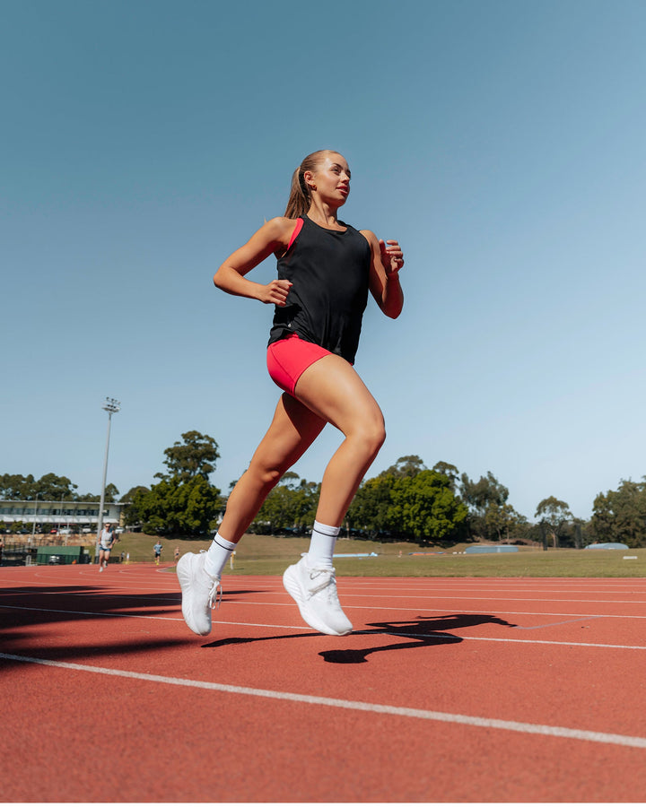 Woman wearing Pace Running Tank - Black
