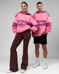Duo wearing A-Team Oversized Hoodie - Candy Pink-Boysenberry | Model:Amity | Size:S | Model:Arran | Size:M