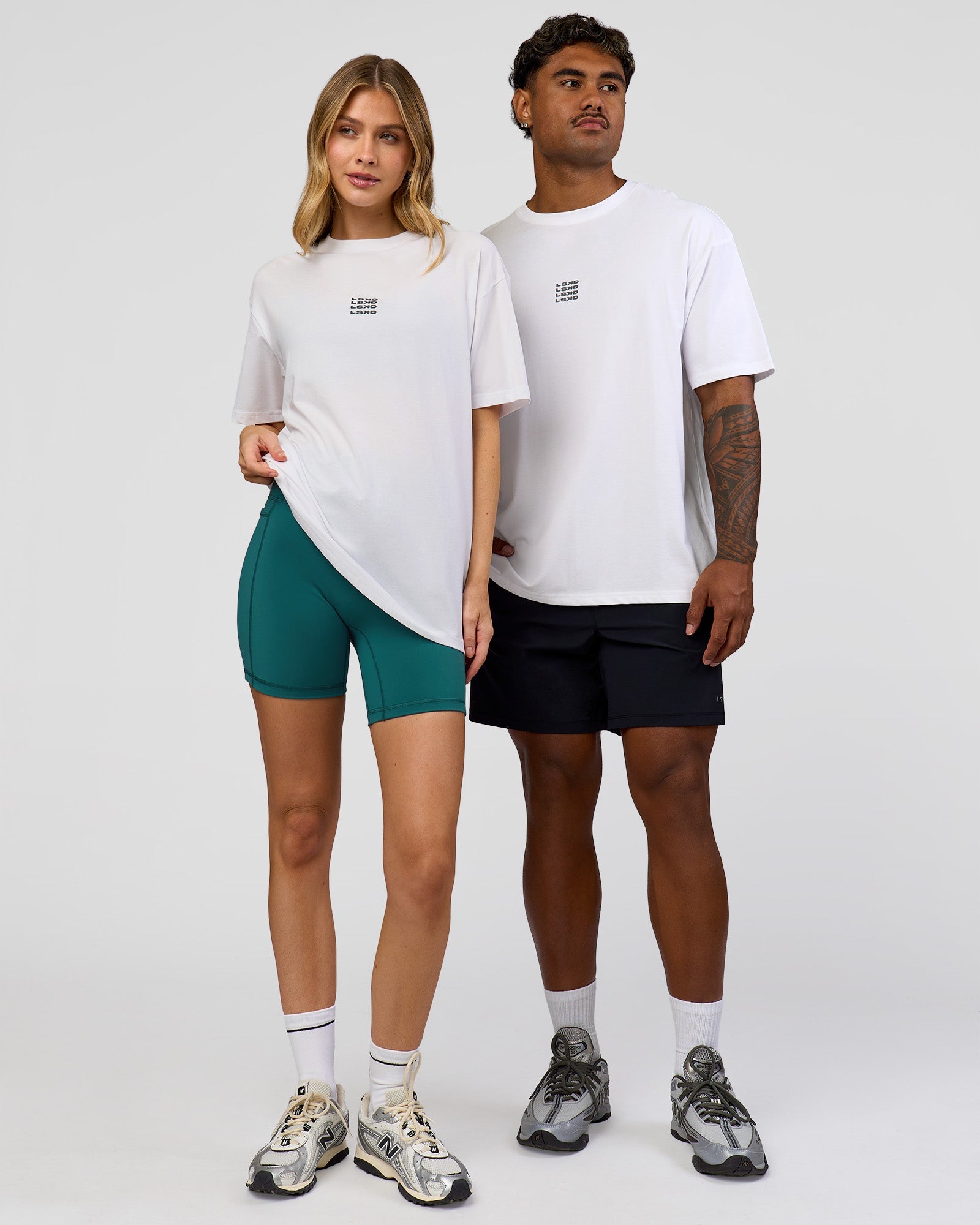 Duo wearing Everyday Elevation FLXCotton Oversized Tee - White-Carbon Green | Model:Leilani | Size:XS | Model:Xav | Size:L