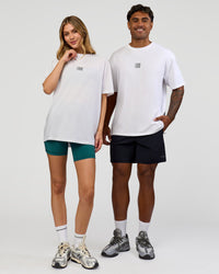 Duo wearing Everyday Elevation FLXCotton Oversized Tee - White-Carbon Green | Model:Leilani | Size:XS | Model:Xav | Size:L