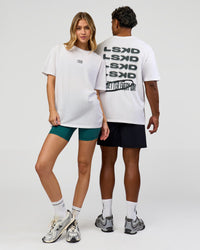 Duo wearing Everyday Elevation FLXCotton Oversized Tee - White-Carbon Green | Model:Leilani | Size:XS | Model:Xav | Size:L
