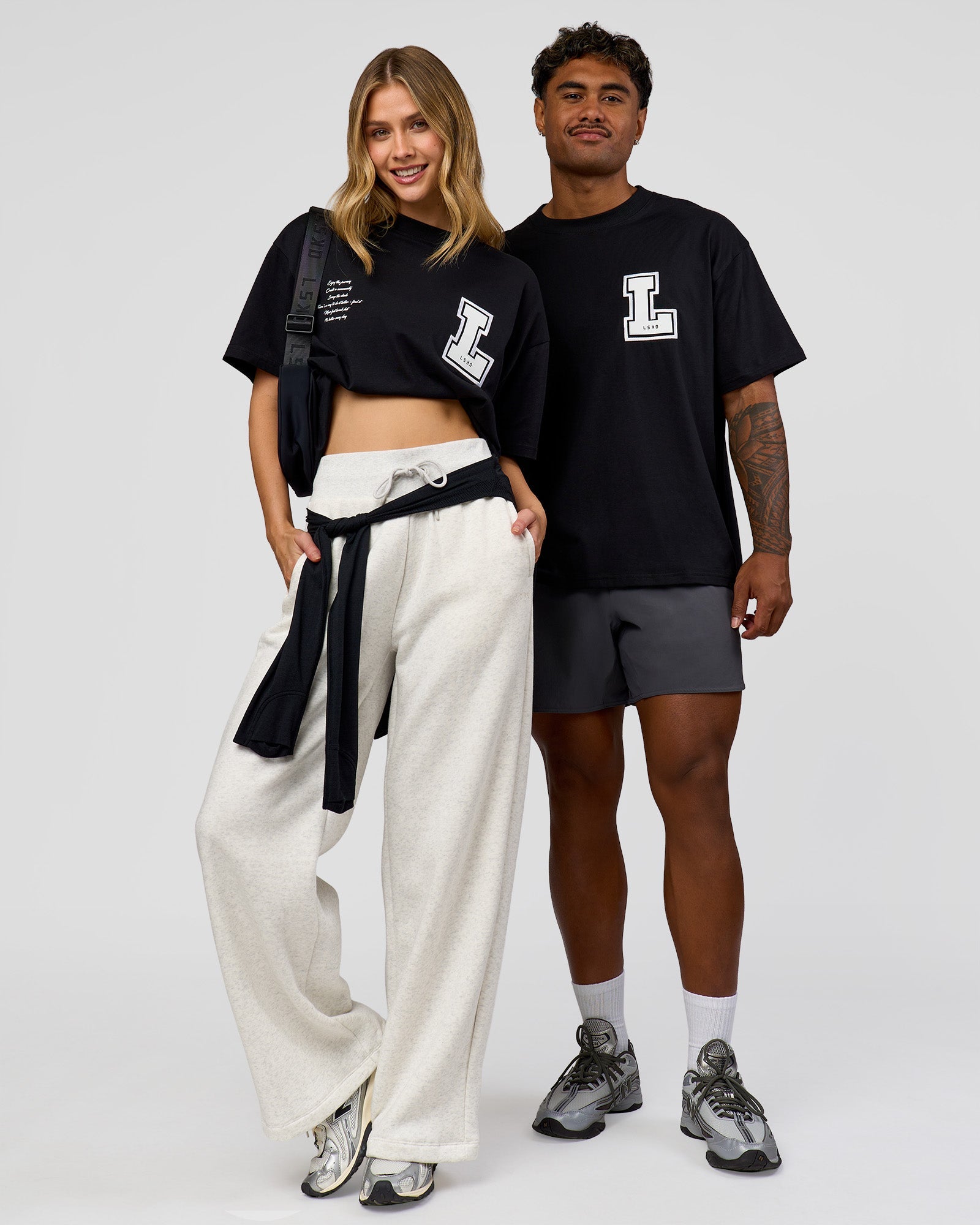 Duo wearing Hype Heavyweight Unisex Oversized Tee - Black-White | Model:Leilani | Size:XS | Model:Xavier | Size:L