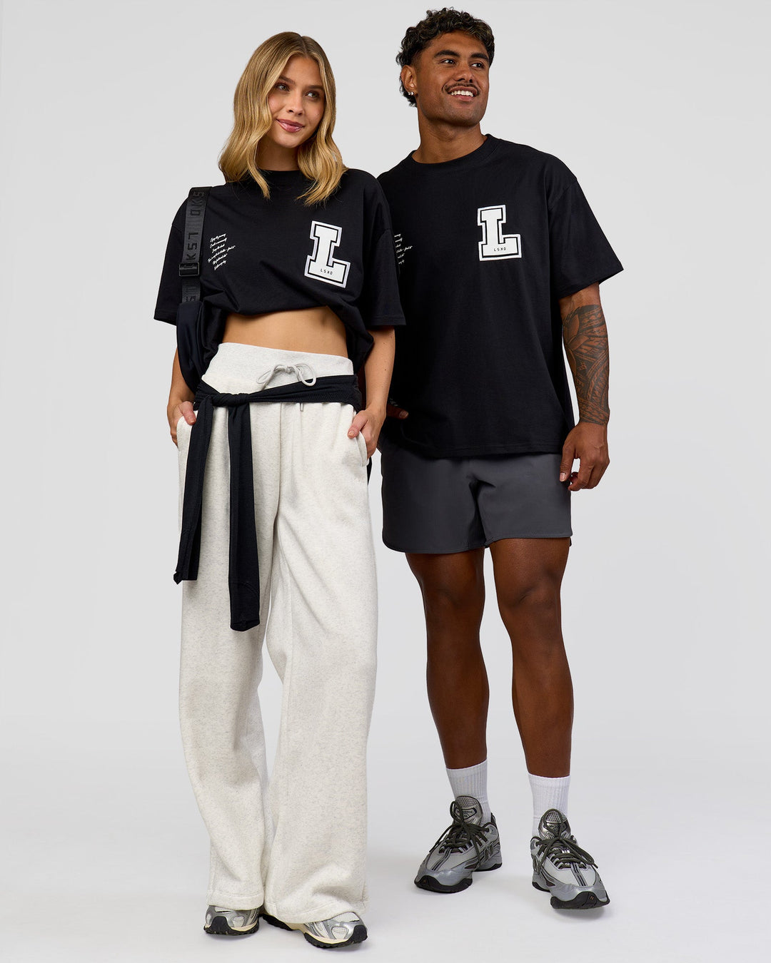 Duo wearing Hype Heavyweight Unisex Oversized Tee - Black-White | Model:Leilani | Size:XS | Model:Xavier | Size:L