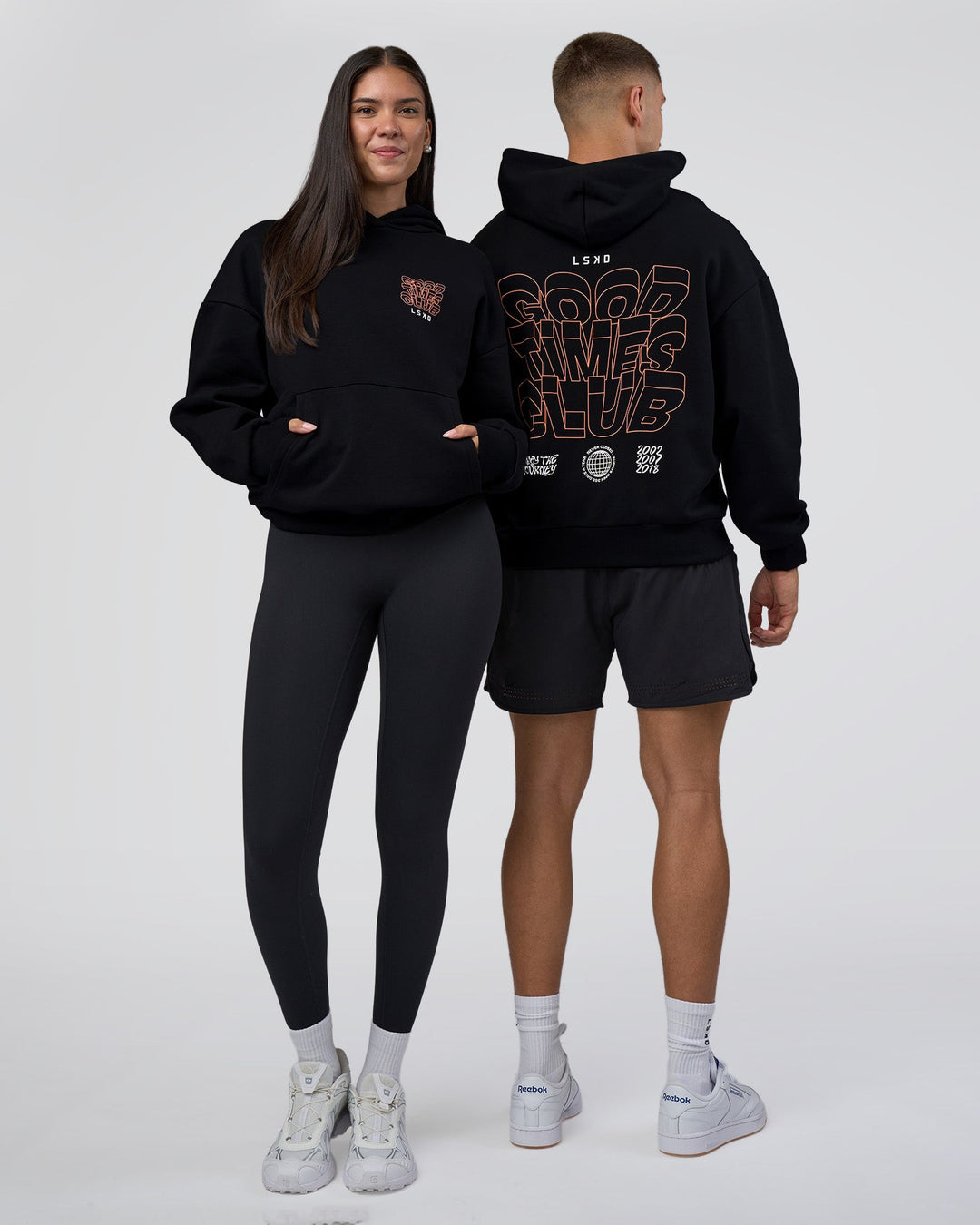 Duo wearing GTC CVC Fleece Unisex Oversized Hoodie - Black-Cantaloupe | Model:Both | Size:Duo