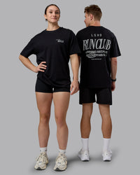 Duo wearing Run Love FLXCotton Oversized Tee - Black-Reflective | Model:Both | Size:Duo