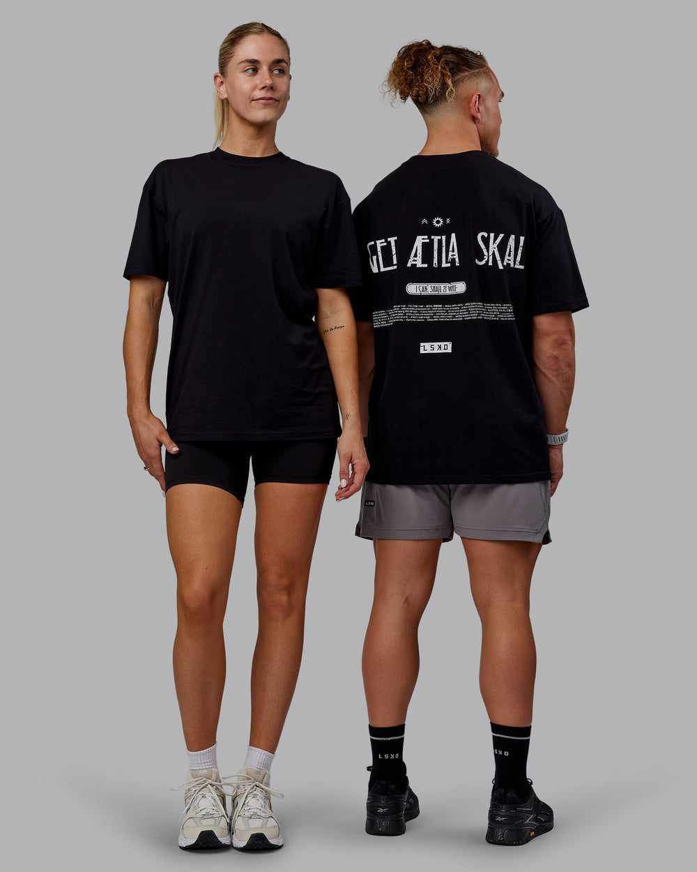 Duo wearing Sara GET ÆTLA SKAL Unisex FLXCotton Oversize Tee - Black-White