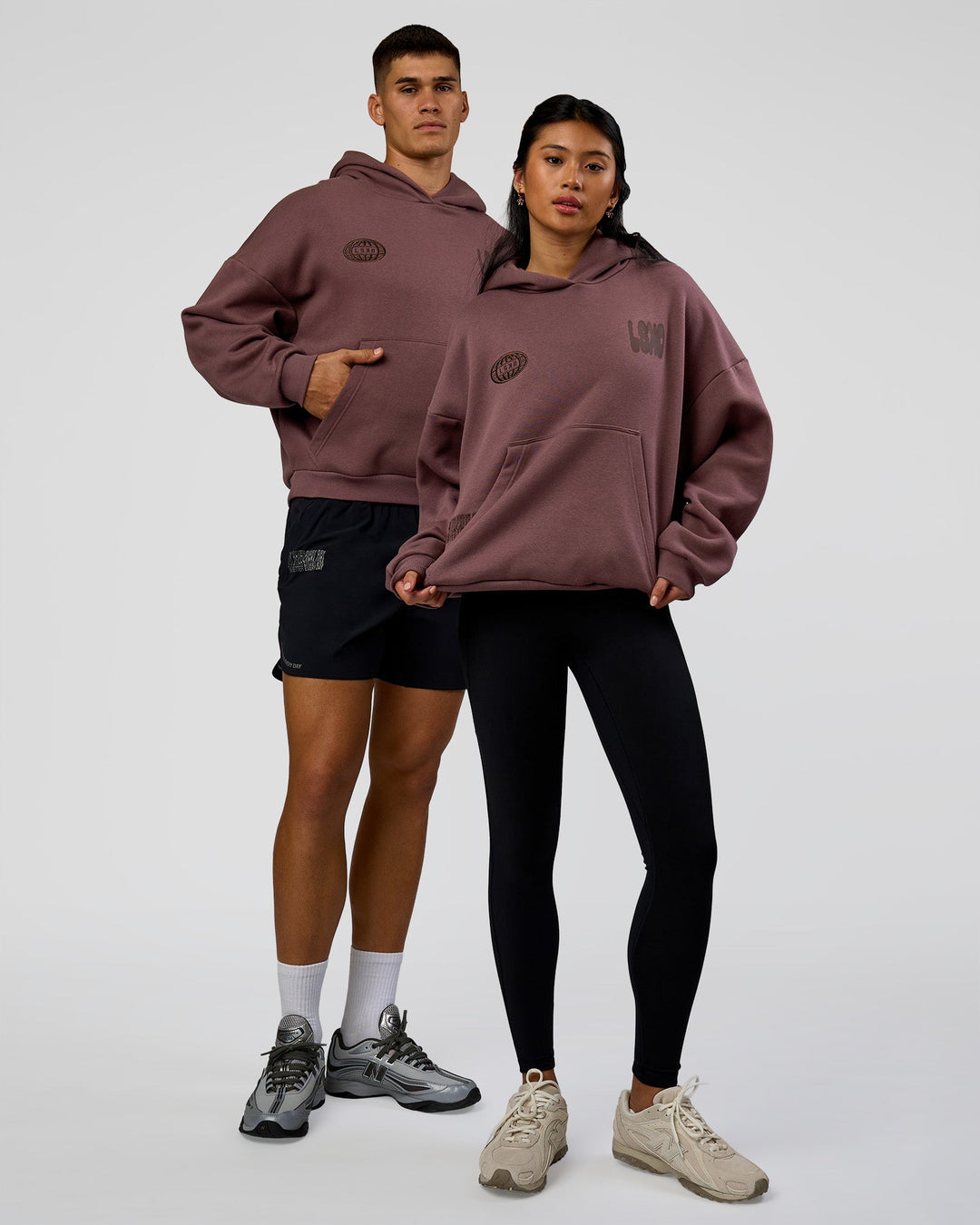 Duo wearing Static Grit Unisex Boxy Hoodie - Cocoa Powder-Hot Chocolate | Model:Both | Size:Duo