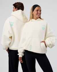 Duo wearing Sticker Unisex Oversized Hoodie - Off White-Jelly Mint | Model:Both | Size:Duo