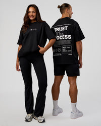 Duo wearing Trust The Process Heavyweight Unisex Oversized Tee - Black-White | Model:Both | Size:Duo