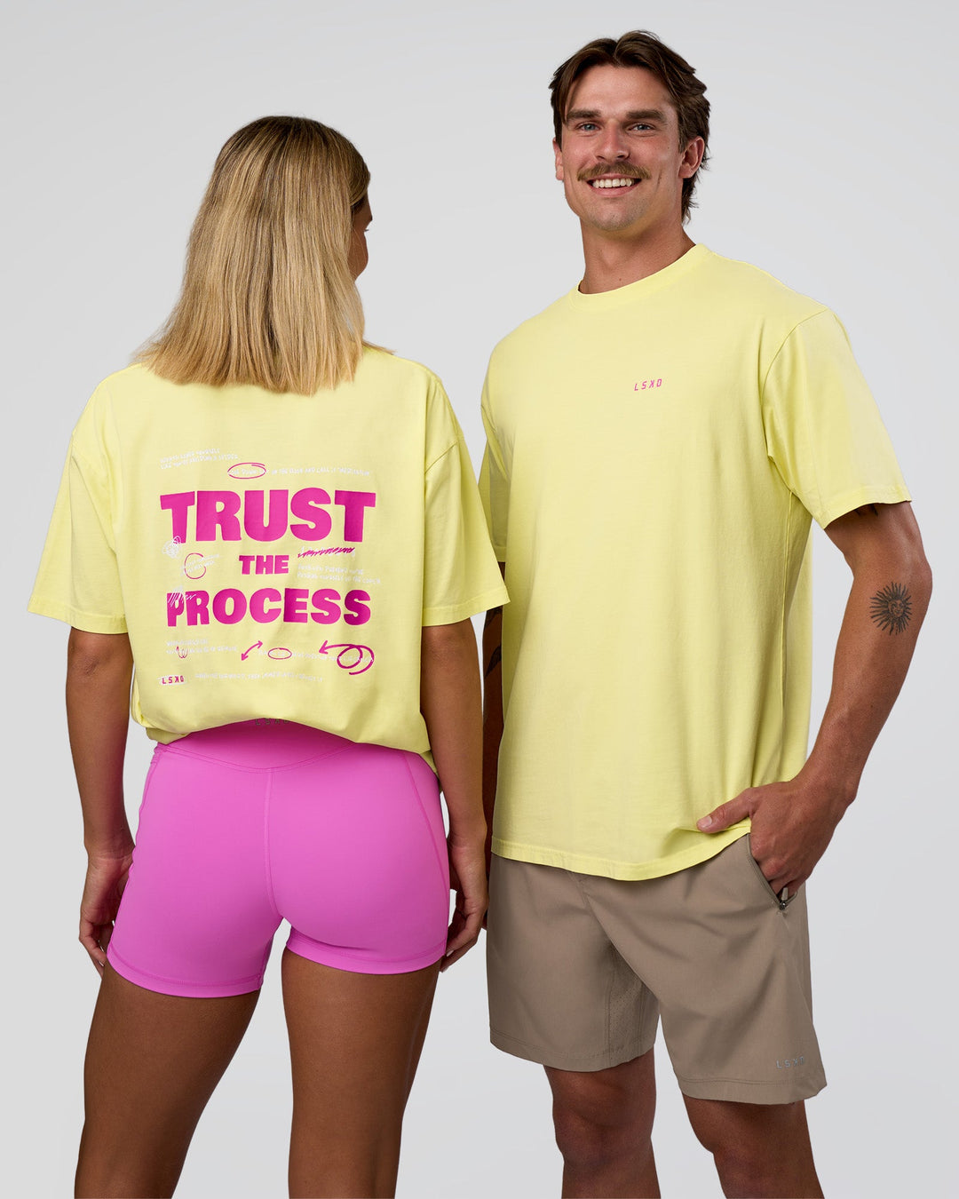 Duo wearing Unfit Club FLXCotton Oversized Tee - Yellow Fizz Washed-Ultra Fuchsia | Model:Both | Size:Duo