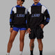 Duo wearing Unisex Slam Hoodie Oversize - Black-Power Cobalt