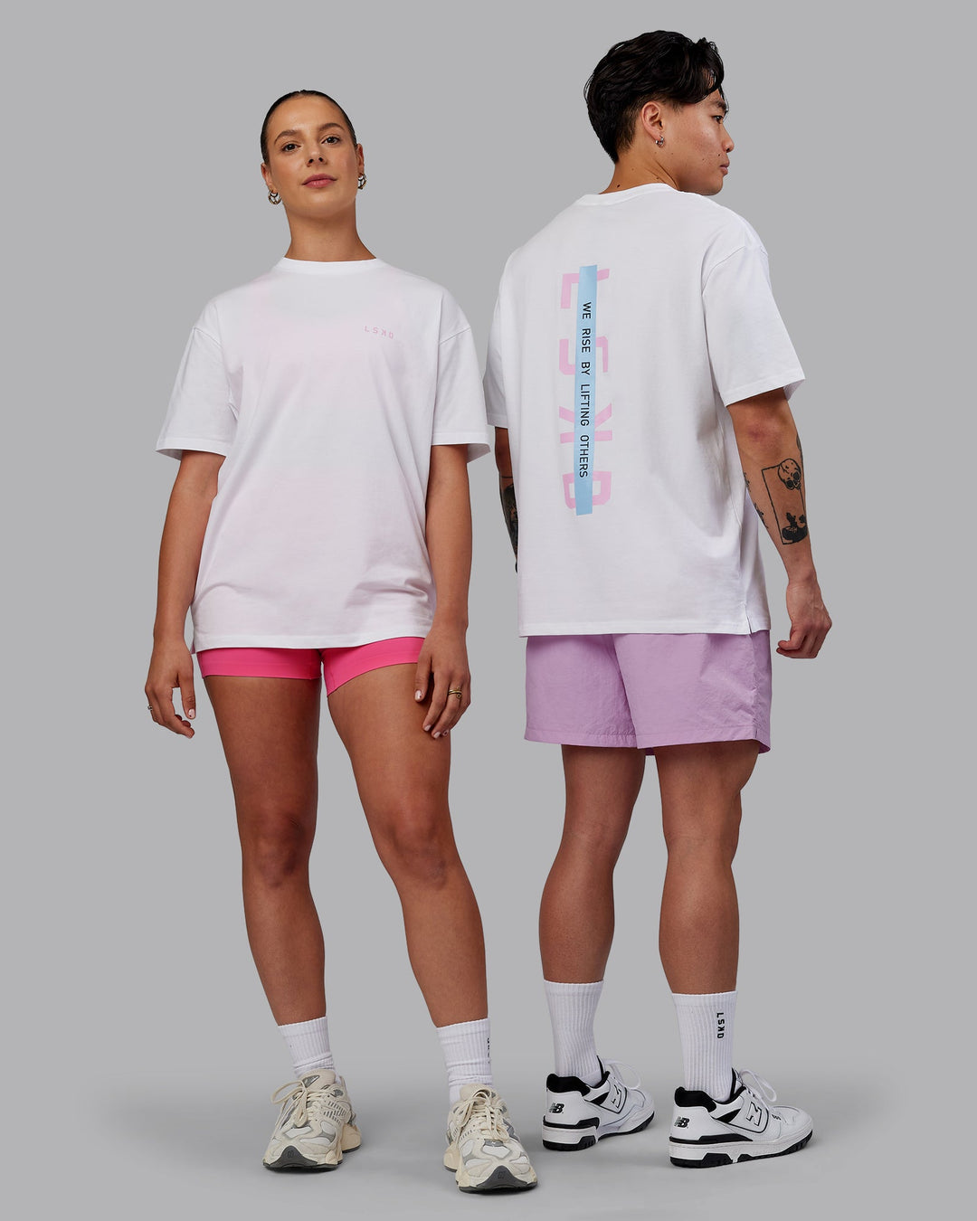 Duo wearing Unisex Strike Through FLXCotton Tee Oversize - White-Bubblegum